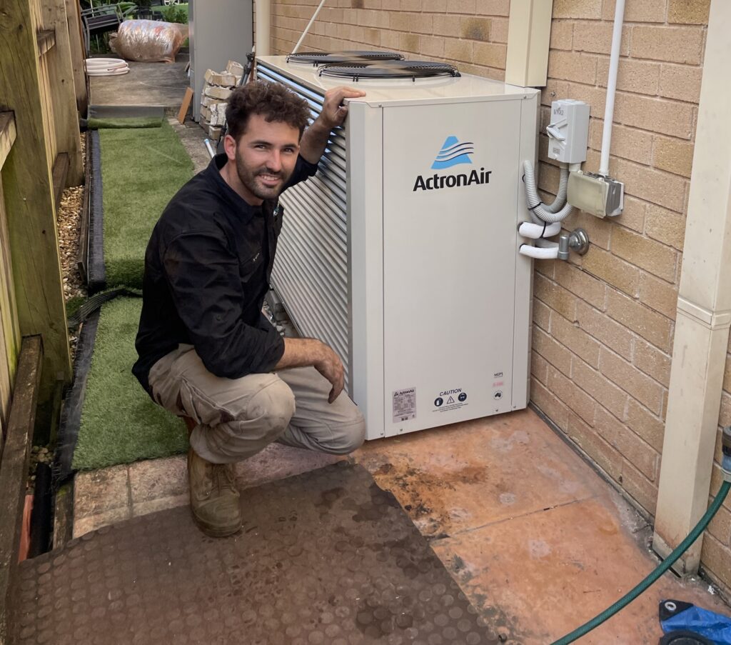 MyTradie Services technician performing AC repair and maintenance in Sydney on an ActronAir unit.