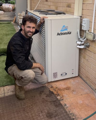 MyTradie Services technician performing AC repair and maintenance in Sydney on an ActronAir unit.